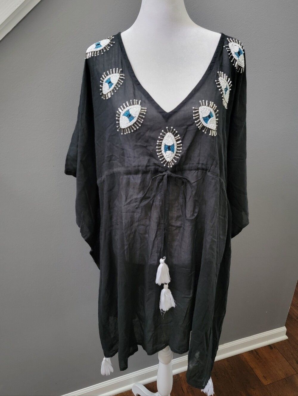 Ingear Black V-Neck Tunic with Beaded Eye Embellishments and White Tassels